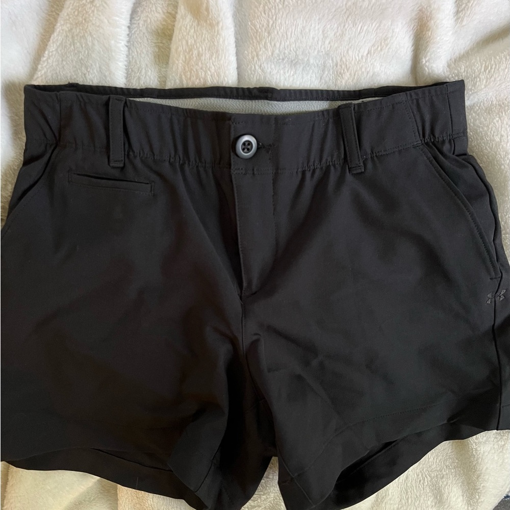 Under Armor golf shorts.